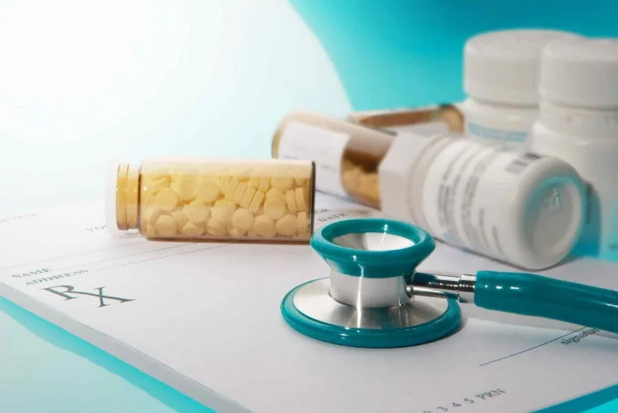 Stethoscope and medication on a prescription
